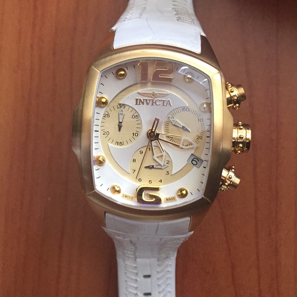 Invicta women’s gold and leather watch